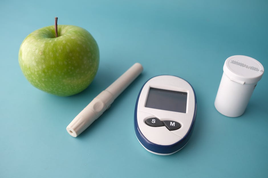 An image of a person checking their blood sugar levels with a glucose monitor.