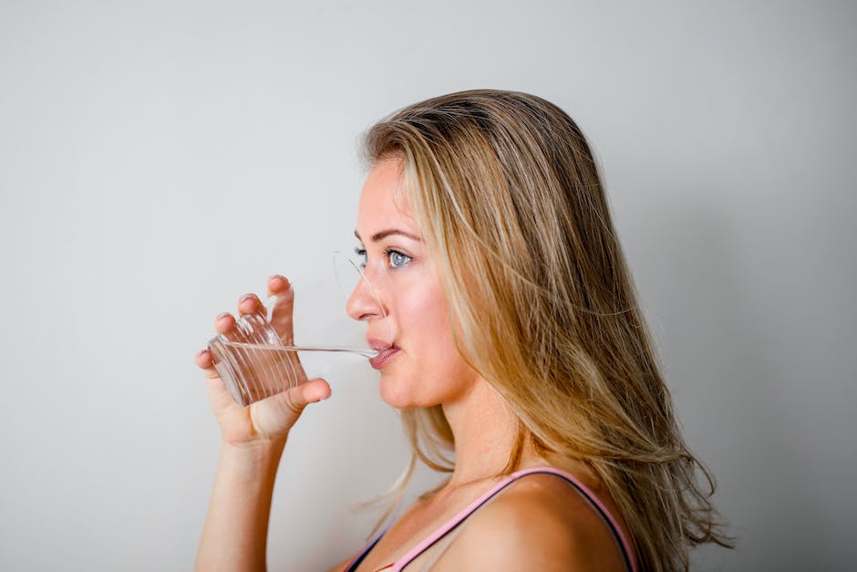 An image of a person drinking water to symbolize hydration