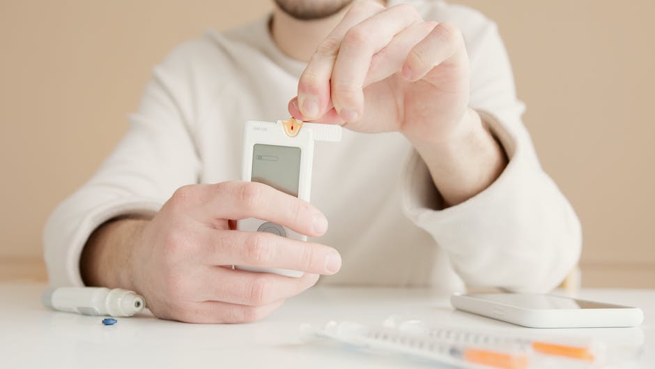 Image featuring a person testing their blood sugar levels with a glucose meter, representing the importance of monitoring in DKA management.