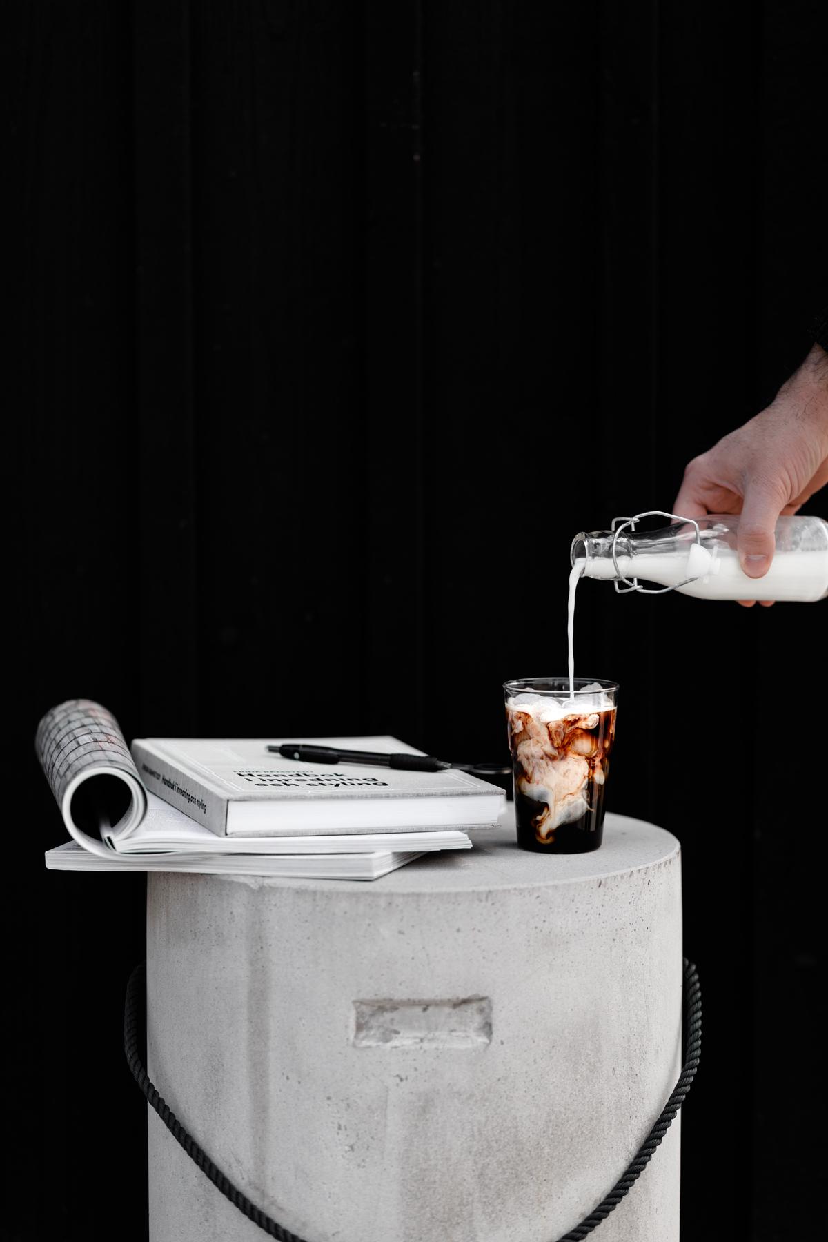 Image depicting a person drinking water from a glass