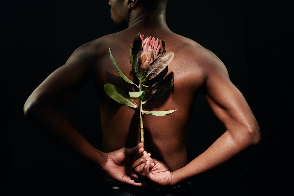 An image showing a person holding a flower, symbolizing emotions and healing