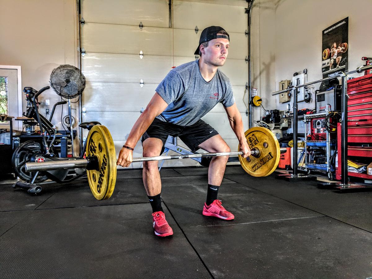 Image depicting a man performing power exercise routines.