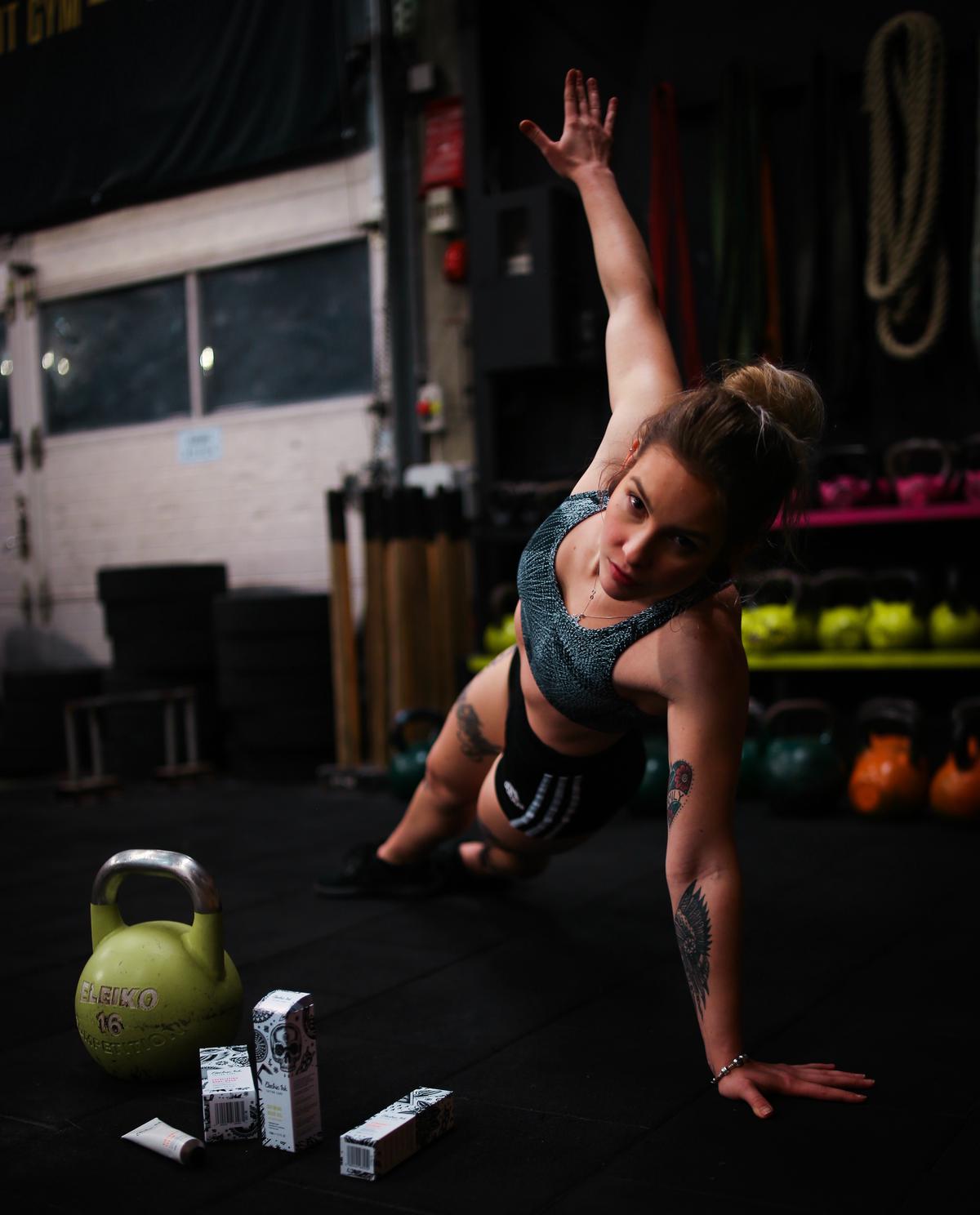 A person performing functional strength training exercises in a gym.