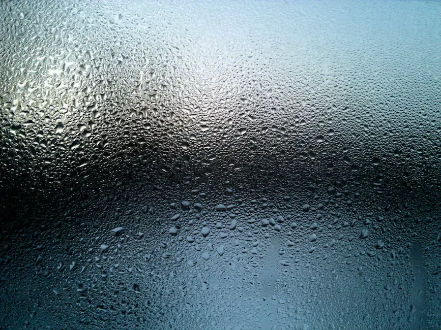 A person drinking water from a glass with a splash of water in the background