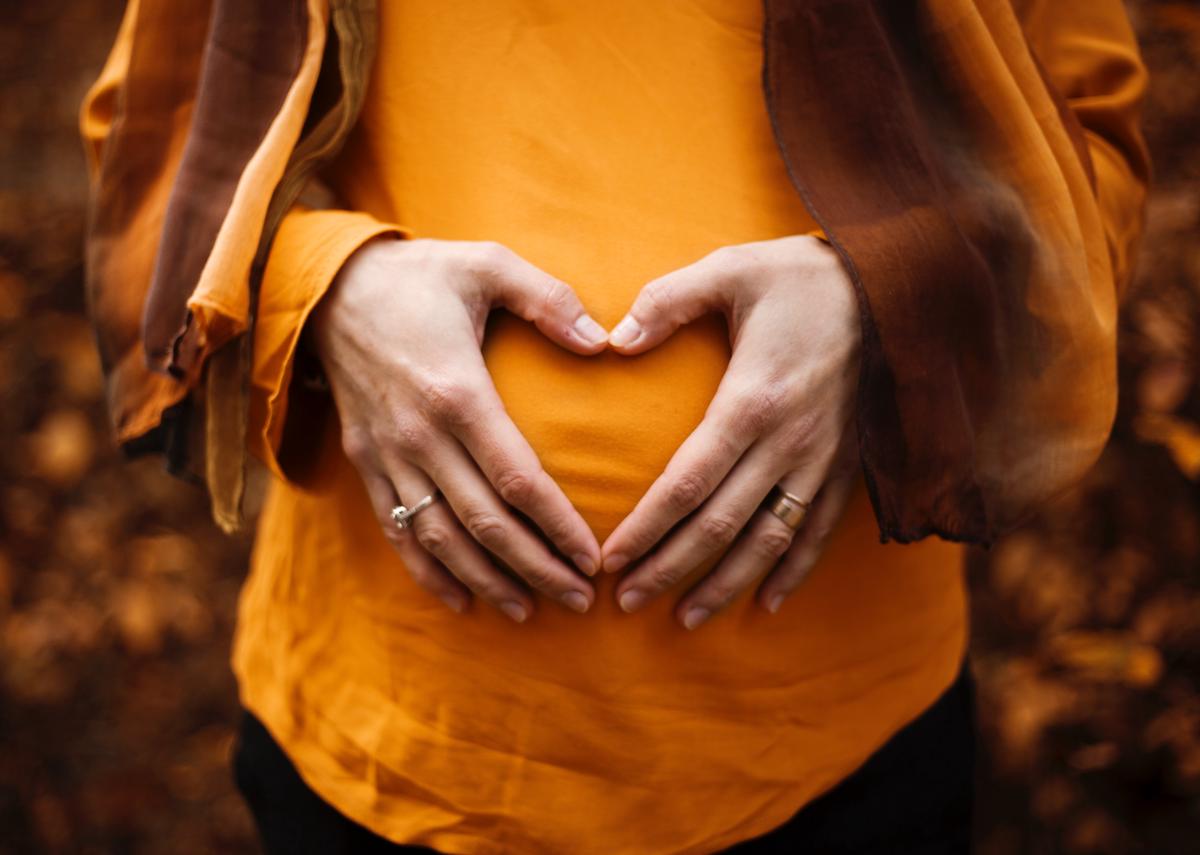 A person holding their belly, indicating IC-related pain