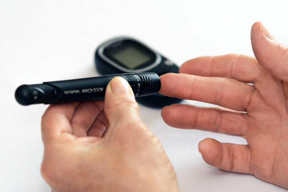 Image of a person checking their blood sugar levels with a glucometer