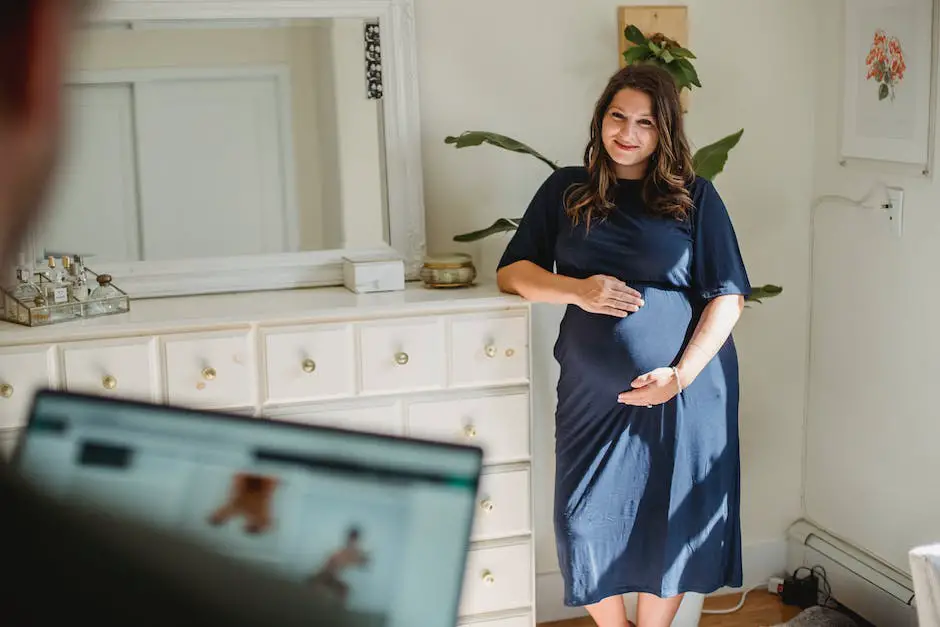 Image of a male holding his pregnant partner's belly, showing support and empathy during pregnancy.