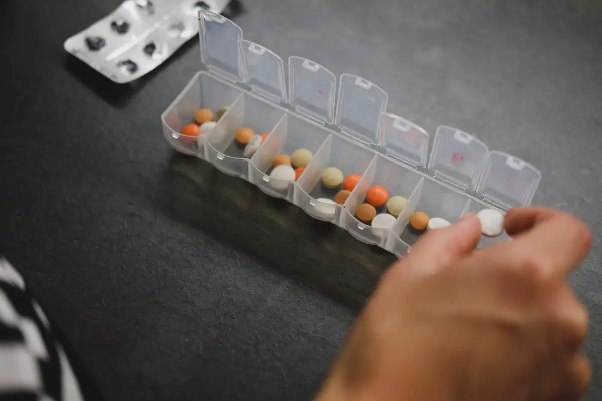 An image of a person taking medication for bladder health.