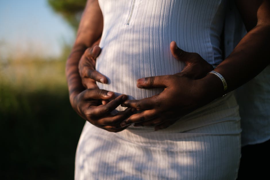 A couple sharing a tender moment during pregnancy.