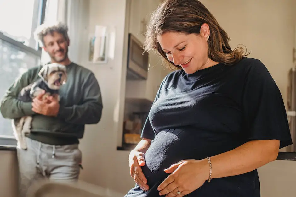 An image depicting a man and a pregnant woman holding hands, showing support and understanding.