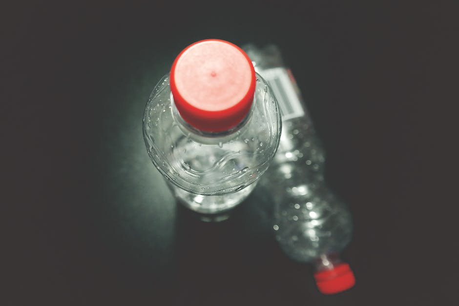 Image depicting a person drinking water during a workout session