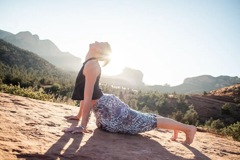 A person doing yoga poses in a peaceful natural setting, with mountains in the background.